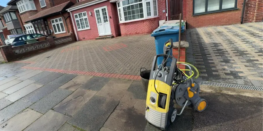 Block paving driveway being pressure washed in Stanmore